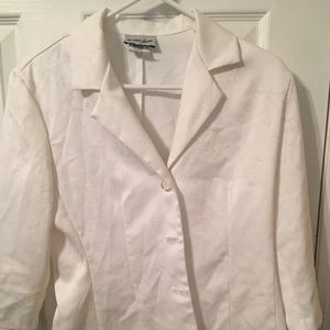 Woman’s white jacket, skirt and pants outfit